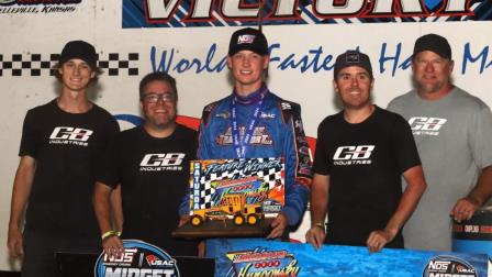 Daison Pursley (Locust Grove, Okla.) and the CB Industries crew celebrate their USAC NOS Energy Drink Midget National Championship feature victory on Saturday night at the Belleville (Kan.) Short Track. (Richard Bales Photo) (Video Highlights from FloRacing.com)